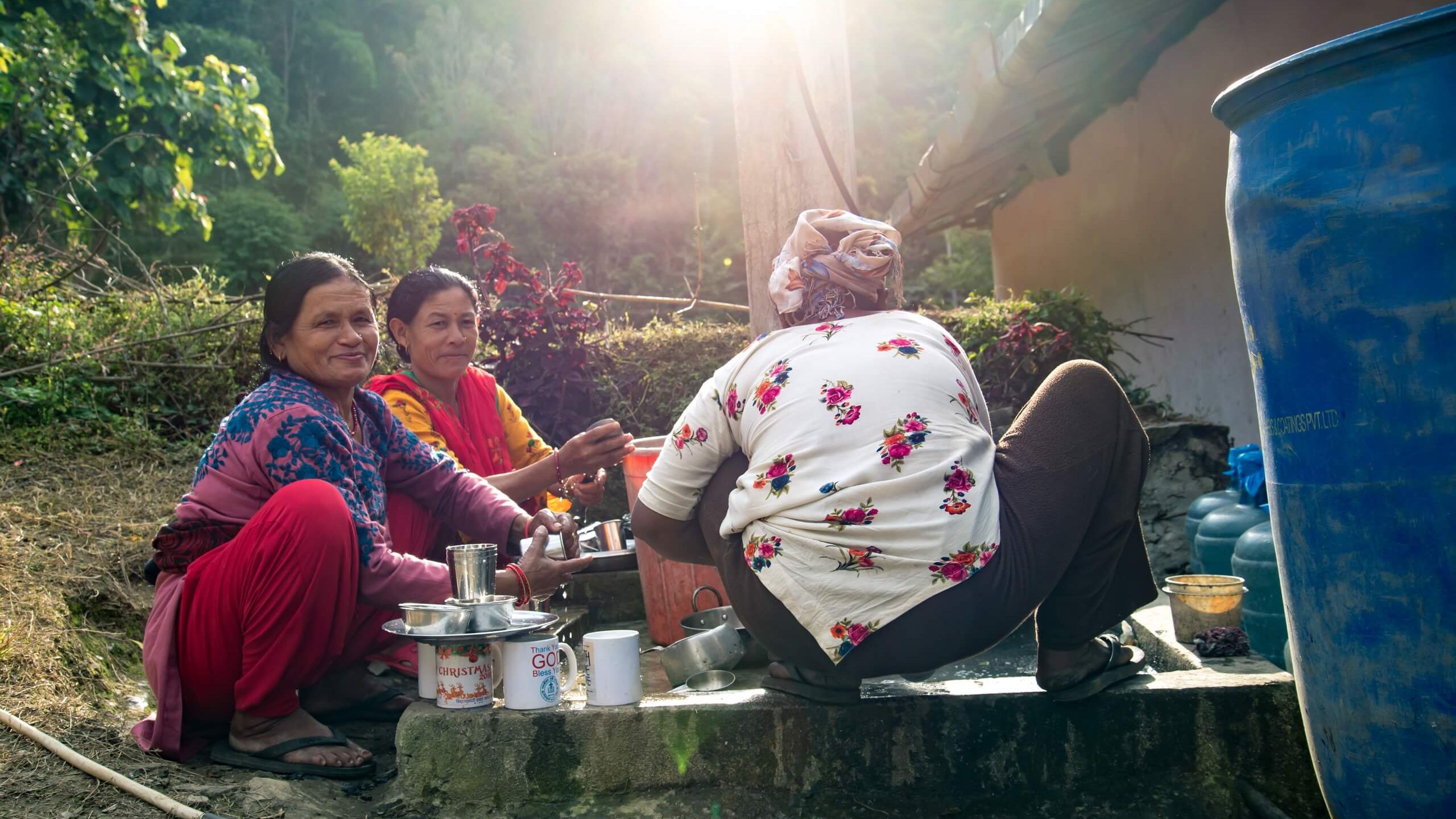 Image: Women washing up at the well in the village of Kaste